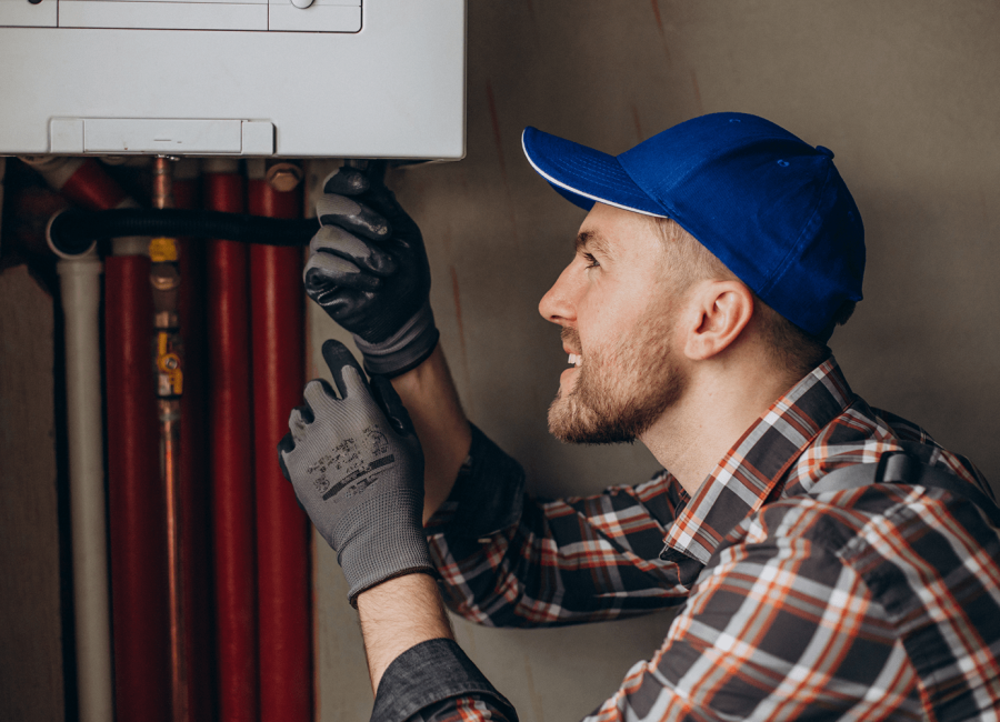 service-man-adjusting-house-heating-system